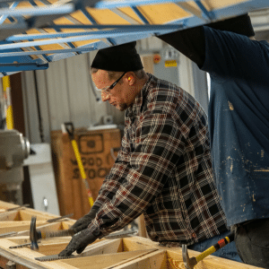Hammering fasteners to truss