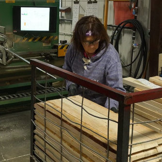 Person organizing lumber